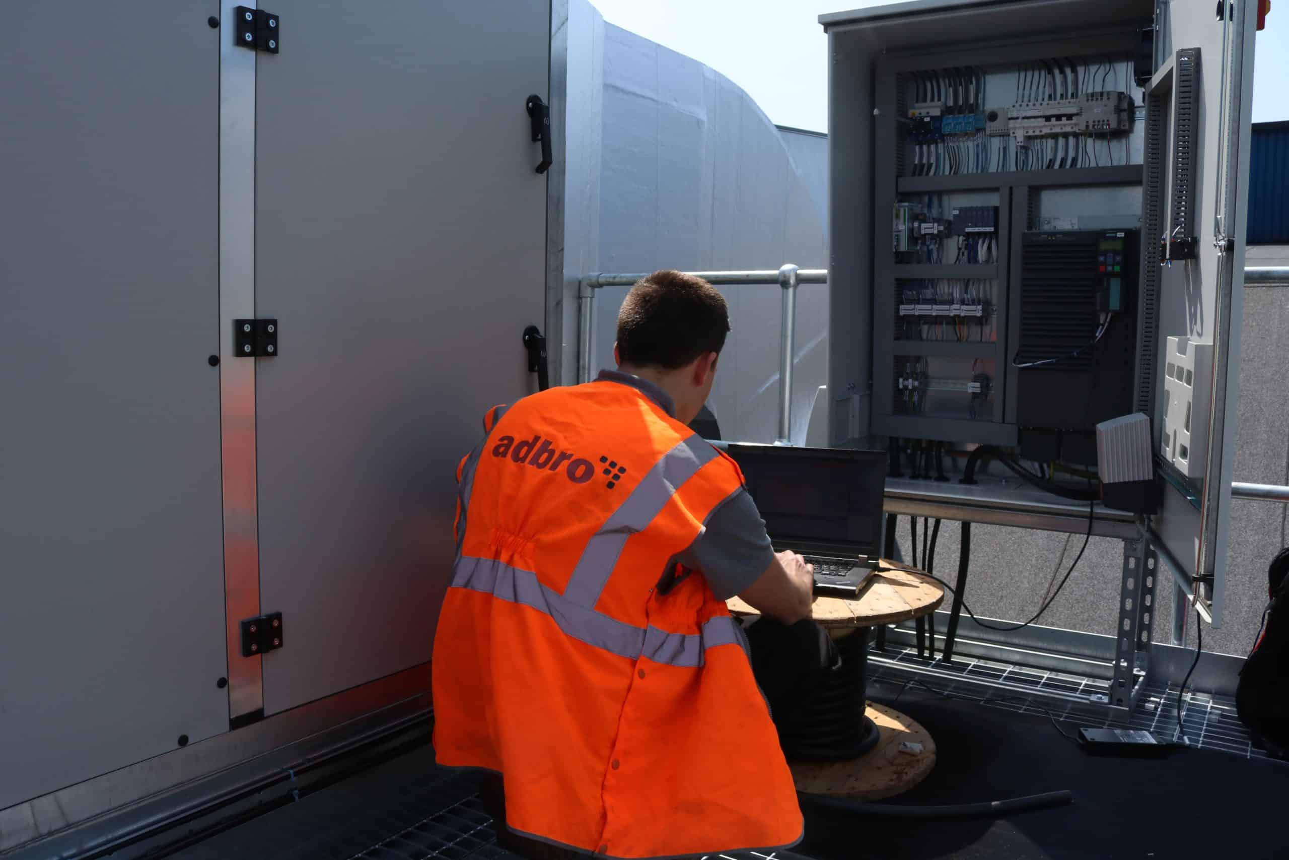 Adbro engineer commissioning an industrial control panel